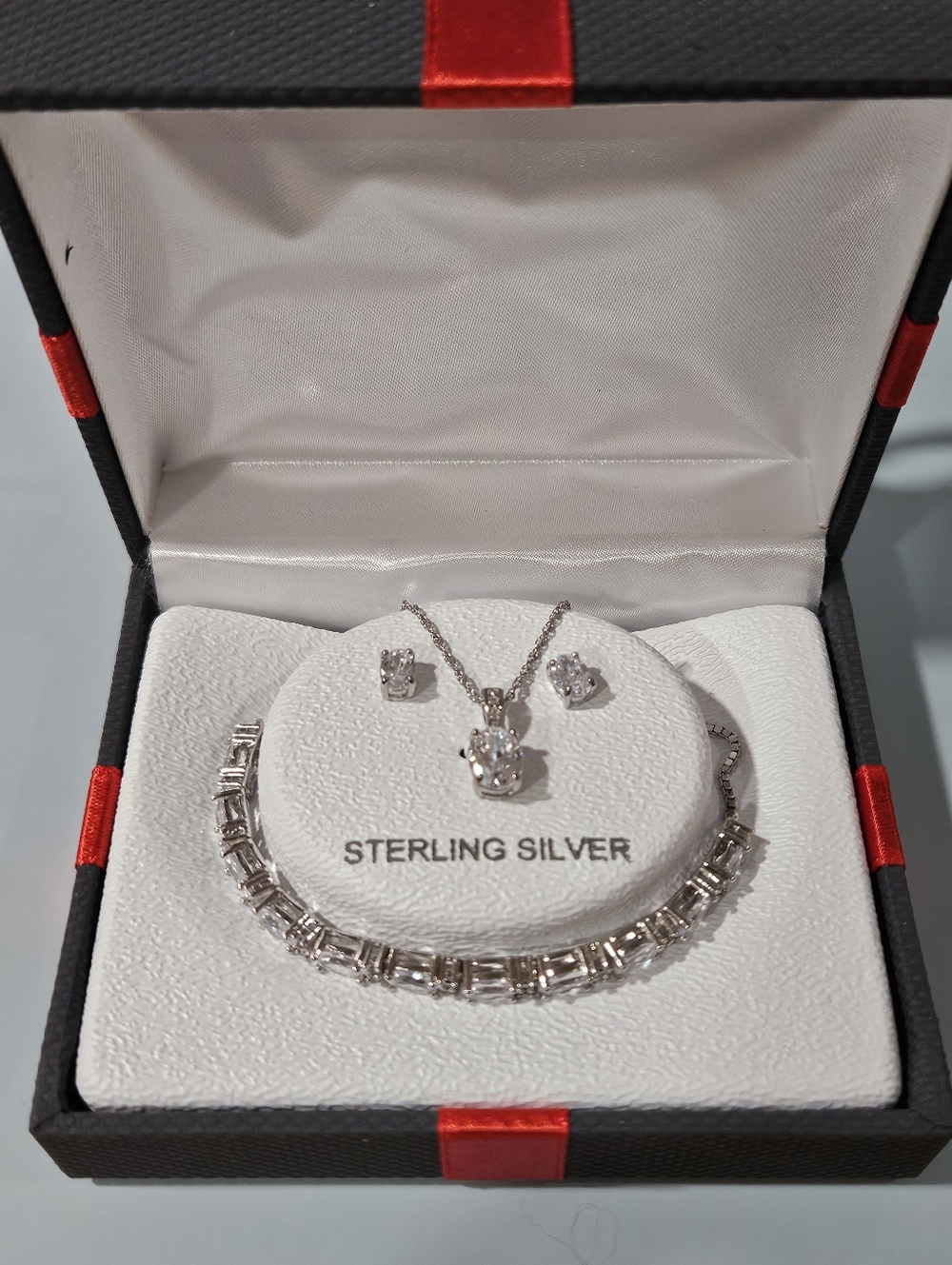 Sterling Silver. Necklace,earrings,bracelet. Cubic Zirconia.They are Beautiful